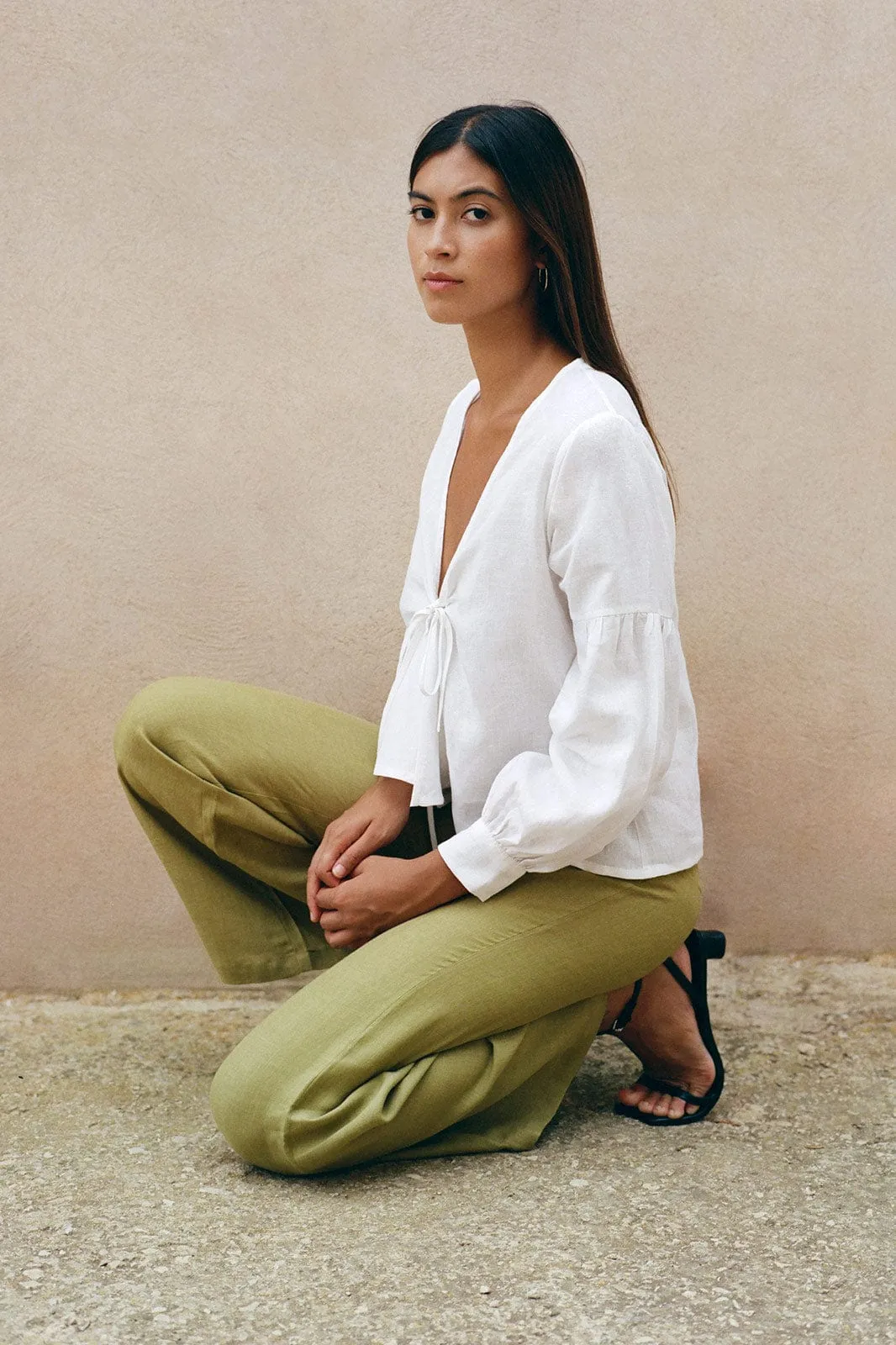 The Clara Flared Linen Trousers in willow green - Sample