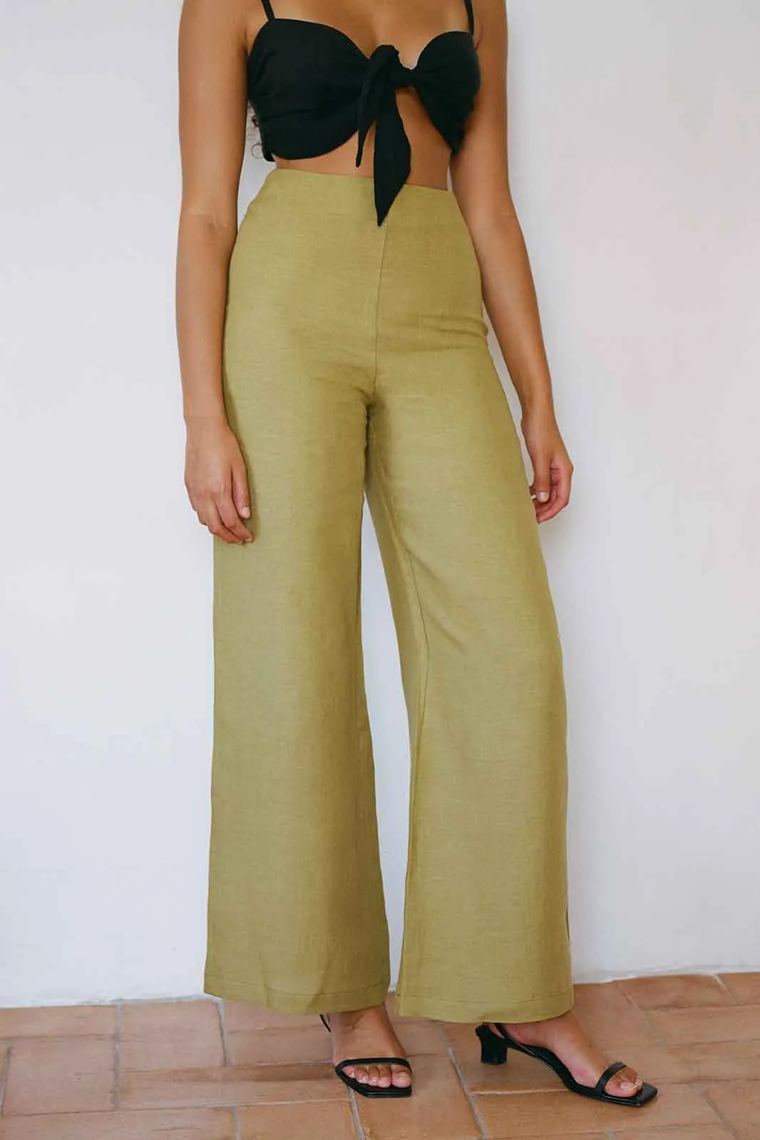 The Clara Flared Linen Trousers in willow green - Sample